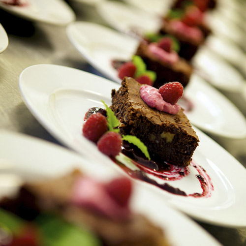 Gooey chocolate brownie, raspberrys and mint