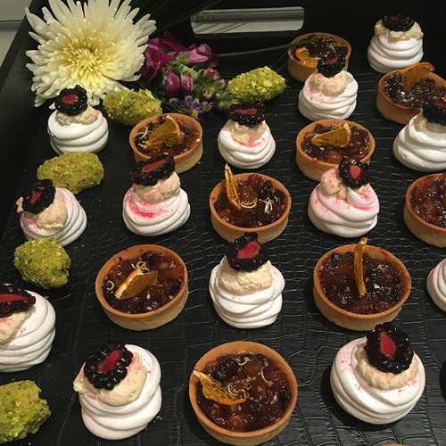 Winter mince tarts, white chocolate and pistachio curls and individual winter blackberry pavlovas